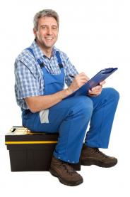  plumbing contractor in Bedford sitting on a toolbox